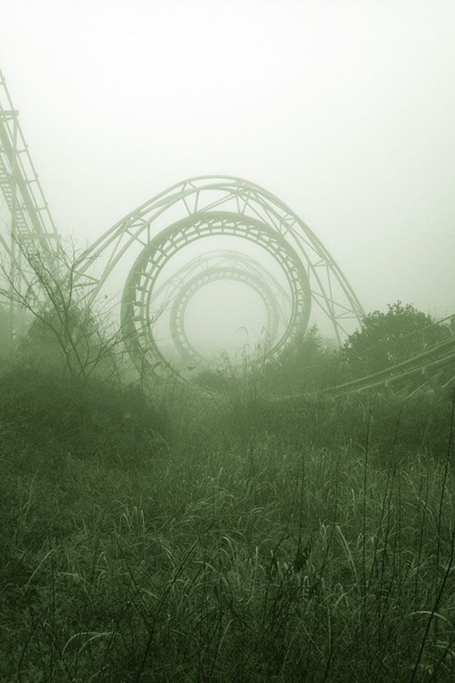 An abandoned roller coaster in the fog