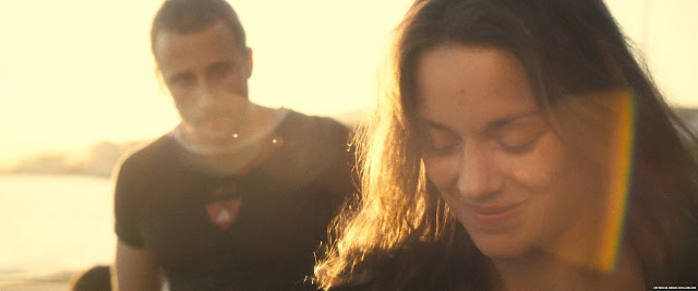 Matthias Schoenaerts and Marion Cotillard are backlist in this still from the film Rust & Bone