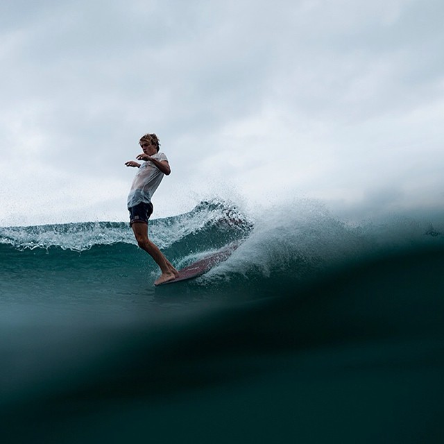 An image of Surfer Harrison Roach hangs ten